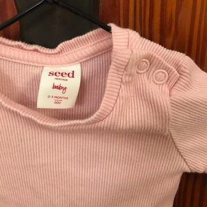 Light pink ribbed long sleeve baby shirt